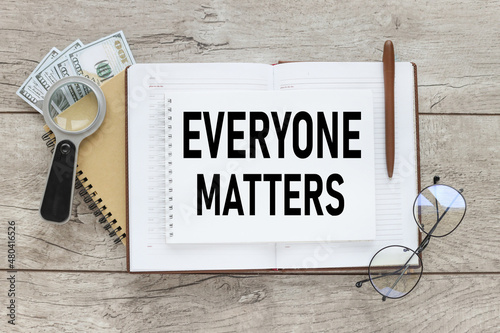 Everyone matters - phrase words from wooden blocks with letters, accepting others individuality everyone matters concept, top view gray background.