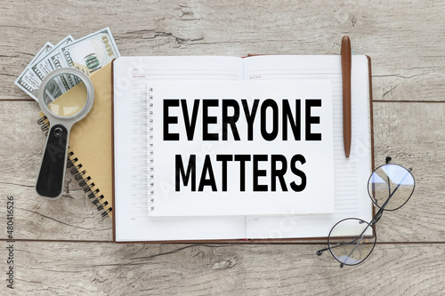 Tableau sur toile Everyone matters - phrase words from wooden blocks with letters, accepting others individuality everyone matters concept, top view gray background