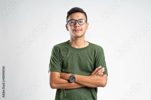 Obraz na płótnie Portrait of handsome cheerful young smiling man in glasses w salonie