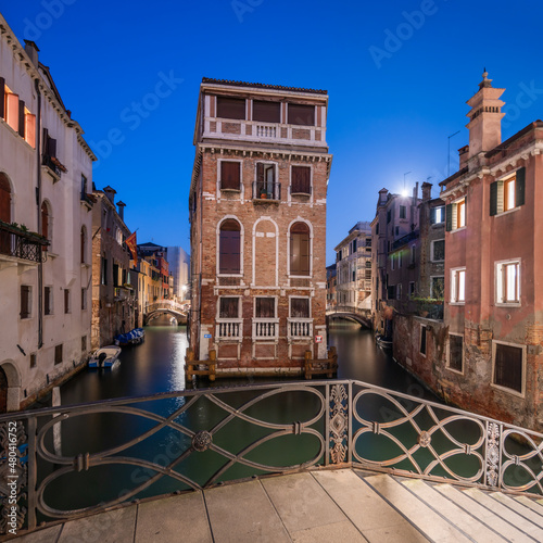 Palazzo Tetta (Tetta Palace) and Ponte dei Conzafelzi (Conzafelzi Bridge) at night, Venice, Italy photo