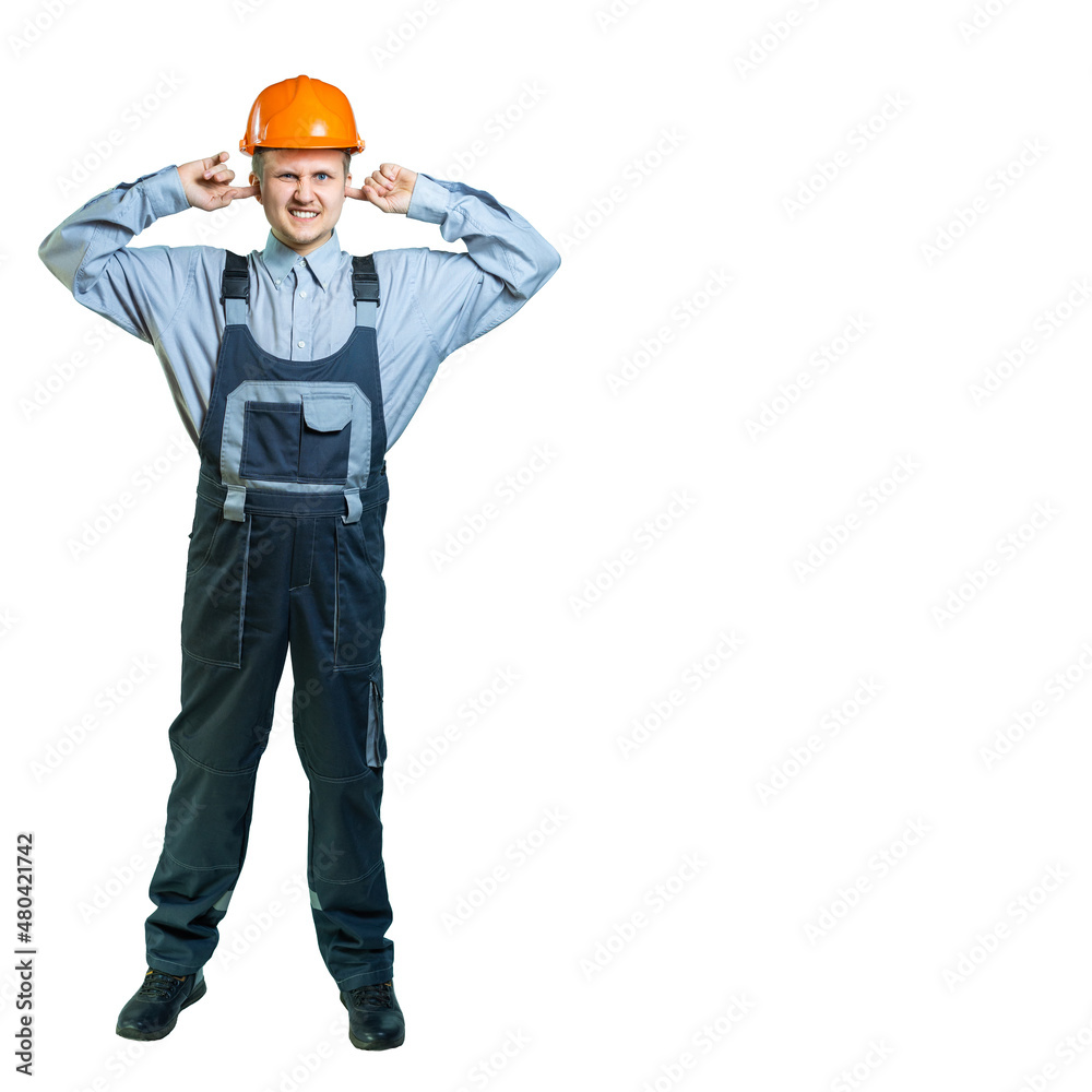 isolated. Engineer, builder covered his ears with his fingers and twisted his face. from loud noise