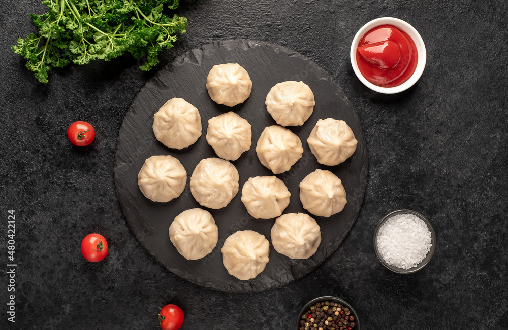 Cooked Khinkali on a stone background