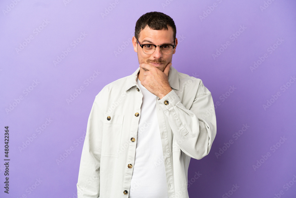 Brazilian man over isolated purple background thinking Brazilian man over isolated purple background thinking
