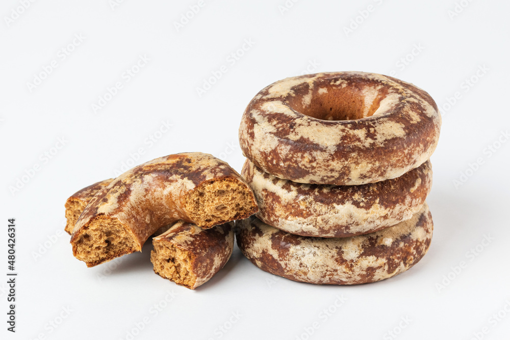 Stack of glazed Russian gingerbread isolated on white background. Round spicy traditional biscuits