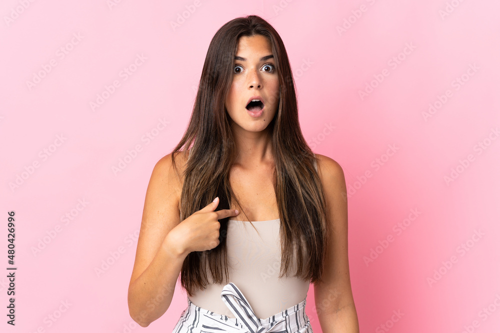 Young brazilian woman isolated on pink background pointing to oneself - obrazy, fototapety, plakaty 