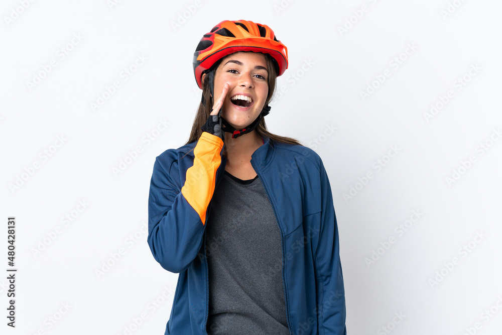 Young cyclist brazilian girl isolated on white background shouting with mouth wide open Young cyclist brazilian girl isolated on white background shouting with mouth wide open