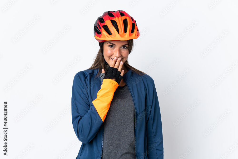 Young cyclist brazilian girl isolated on white  background happy and smiling covering mouth with hand - obrazy, fototapety, plakaty 