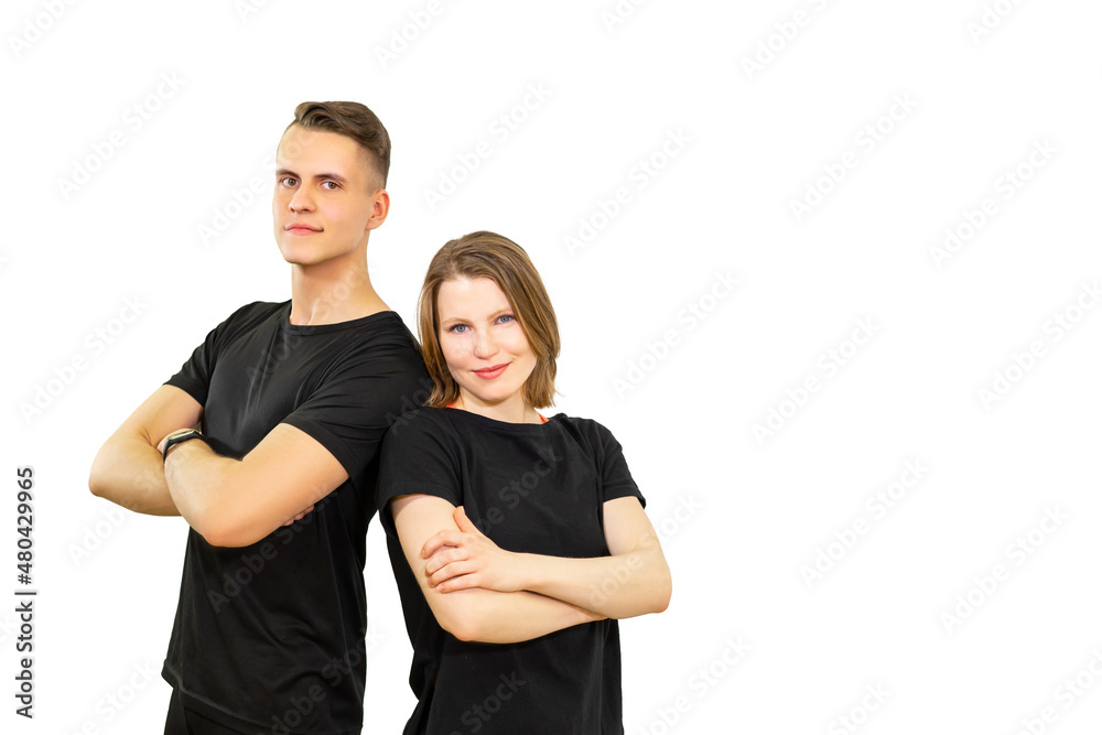 athletes, a man and a woman folded their arms across their chests and look at the camera. beautiful young people are smiling. isolated athletes, a man and a woman folded their arms across their chests and look at the camera. beautiful young people are smiling. isolated