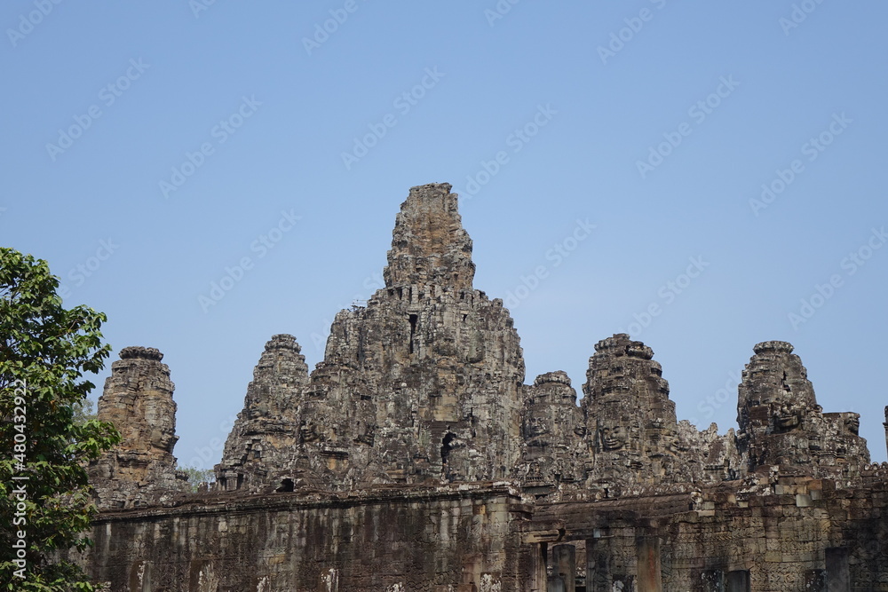 Adventure of exploring mystic Bayon temple in the impressive Khmer ruin city Angkor Thom, Siem Reap, Cambodia