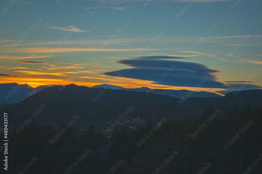A picturesque landscape view of the French Alps mountains in the Hautes-Alpes department during the sunset