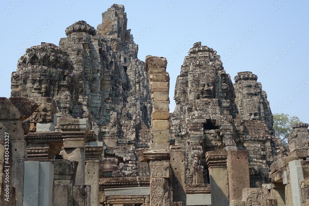 Adventure of exploring mystic Bayon temple in the impressive Khmer ruin city Angkor Thom (horizontal image), Siem Reap, Cambodia