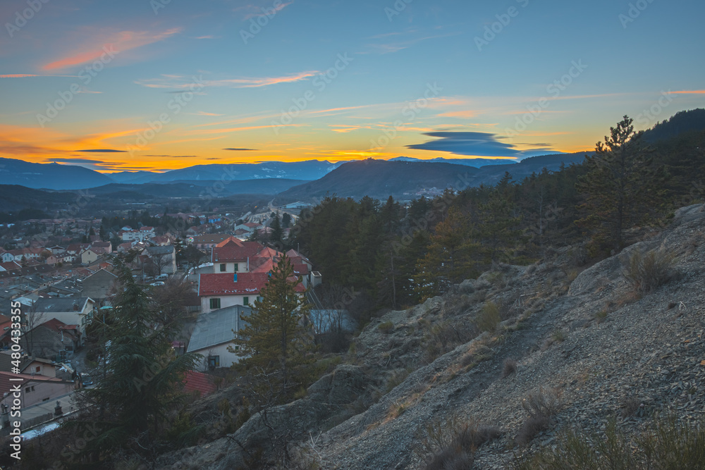 A panoramic wide landscape view of Veynes, an old town in the French Alps, during the sunset