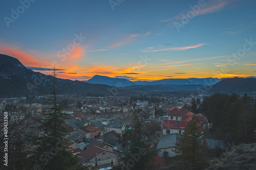 A panoramic wide landscape view of Veynes, an old town in the French Alps, during the sunset