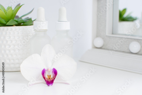 Two bottles of skincare serums in a white clean background