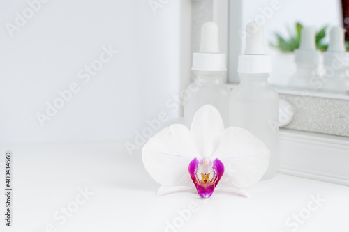 Two bottles of skincare serums in a white clean background