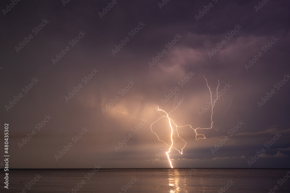 Lightning over the sea at night in the south
