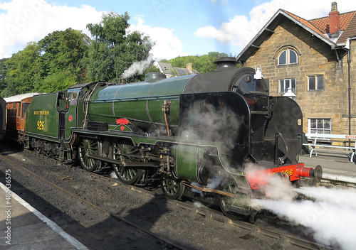 Steam locomotive Repton (Number 30926) from the Schools Class No.30926 along with its tender. Shown here is the olive green livery of Southern Railways. This locomotive was completed at Eastleigh, Ham photo