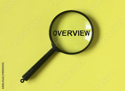 Overview word. Summary and recap concept. Magnifying glass on yellow background