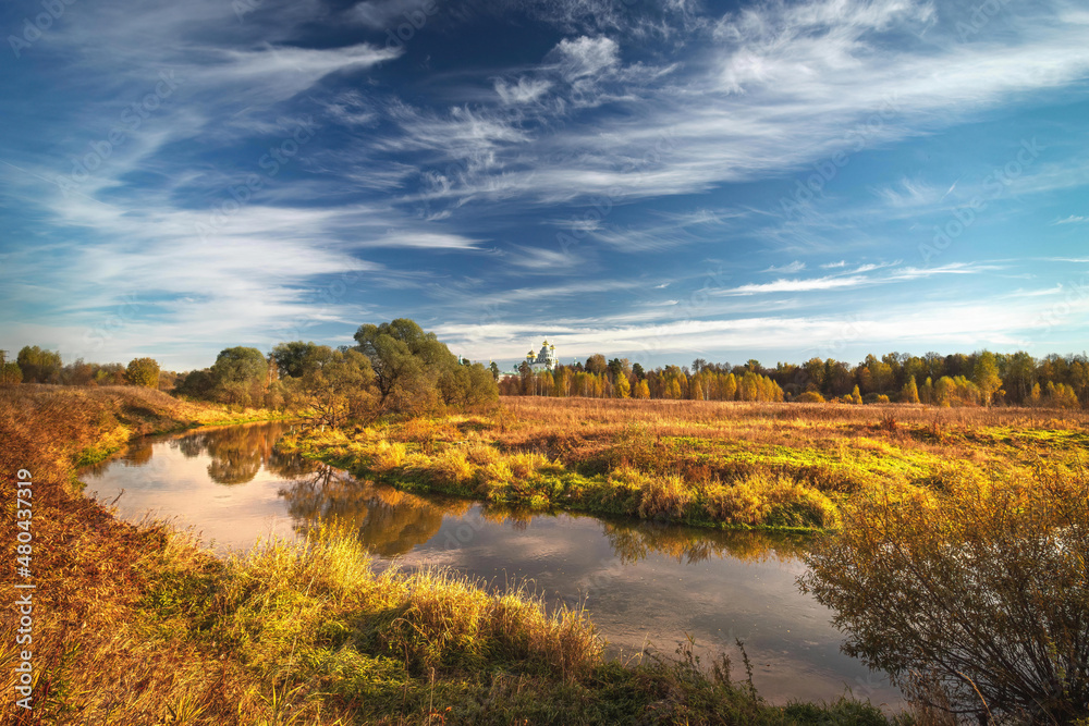 golden autumn landscape of New Jerusalem Monastery and Istra River, sky and clouds, Istra, Moscow region, Russia