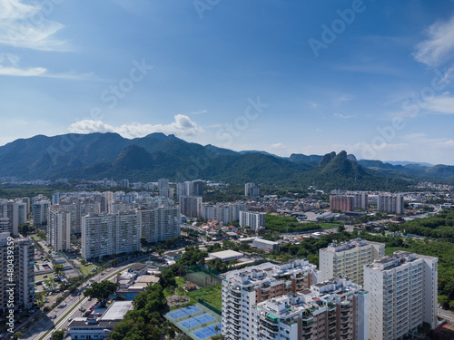 Aerial view of Jacarépagua in Rio de Janeiro, Brazil. Residential buildings and mountains in the background. Sunny day. Drone photo photo