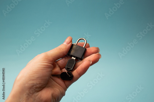 Girl holding a lock with a key
