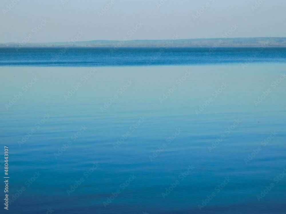 view of beautiful blue lake and forest