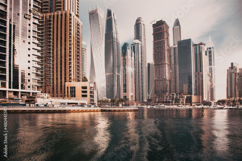 Photography DUBAI, UAE - FEBRUARY 2018: View of modern skyscrapers shining in sunrise lights  in Dubai Marina in Dubai, UAE