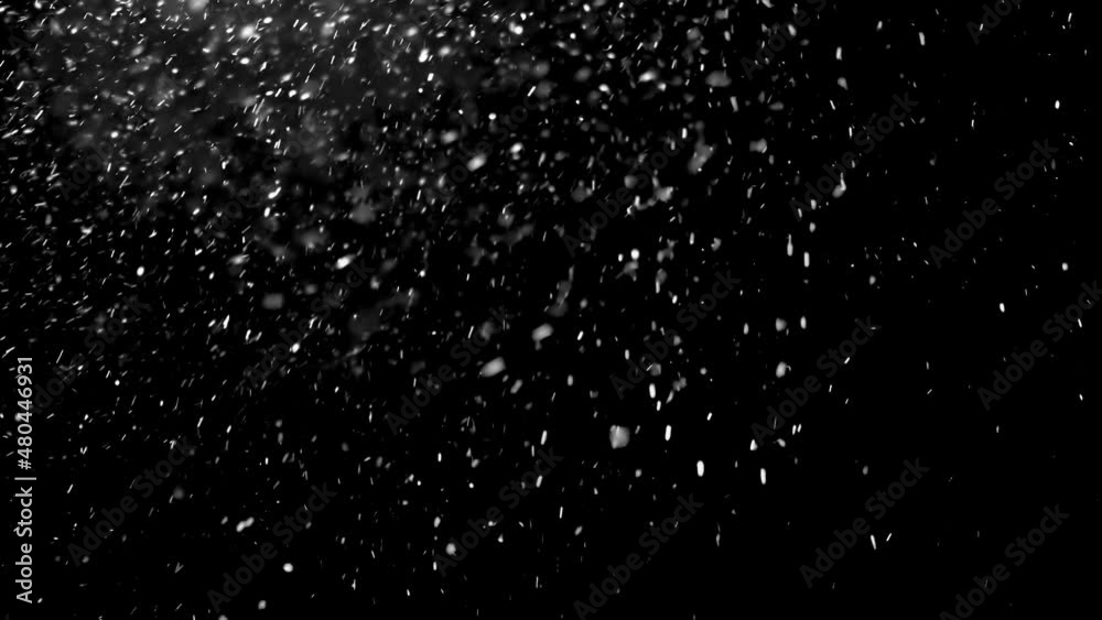 It is snowing heavily in cold winter season on black background It is snowing heavily in cold winter season on black background