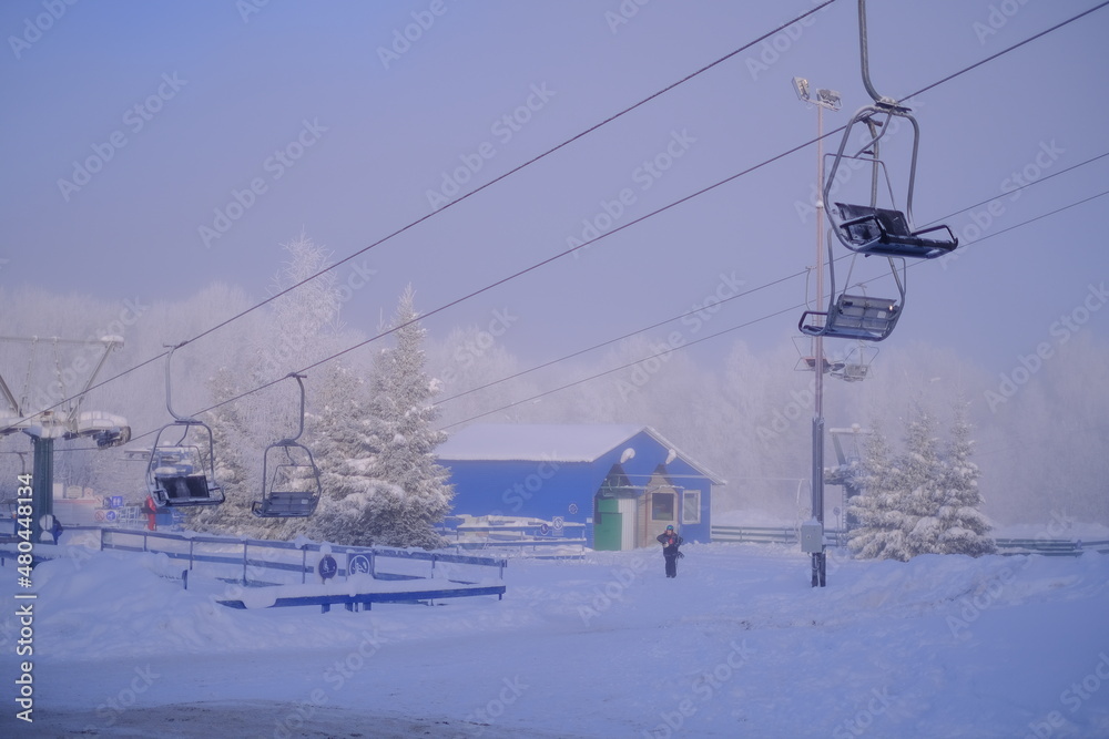 Snow-covered trees in hoarfrost at a ski resort, lift, funicular, ski lift
