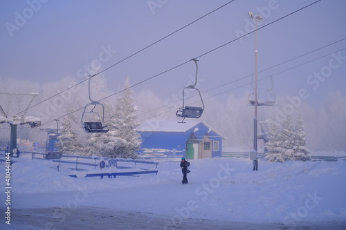 Snow-covered trees in hoarfrost at a ski resort, lift, funicular, ski lift 