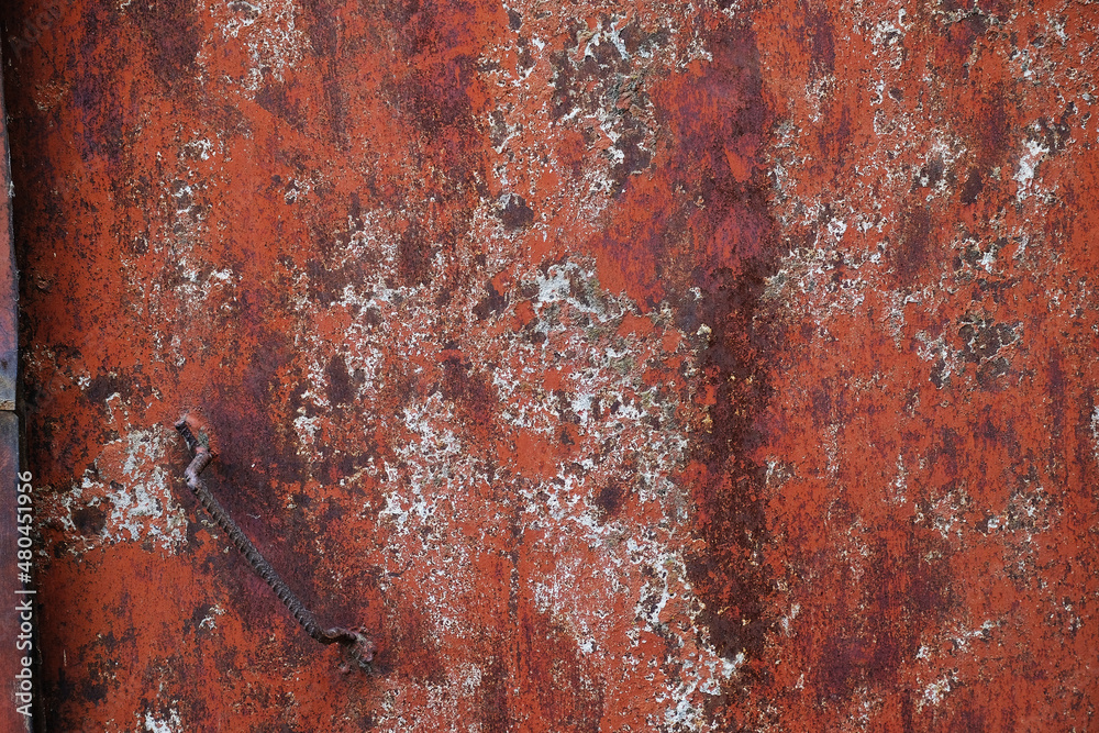 Background of texture grunge metal door in red colors Background of texture grunge metal door in red colors