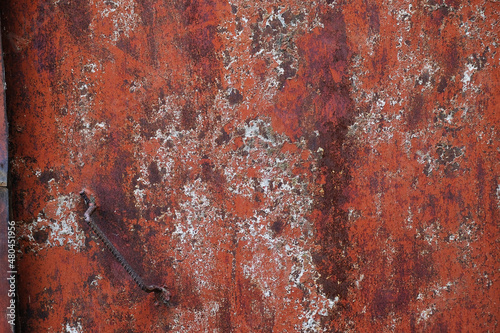 Background of texture grunge metal door in red colors