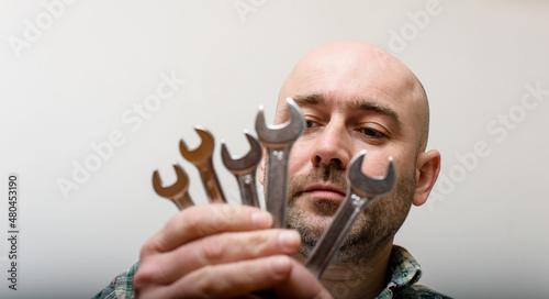 man with wrench on white background