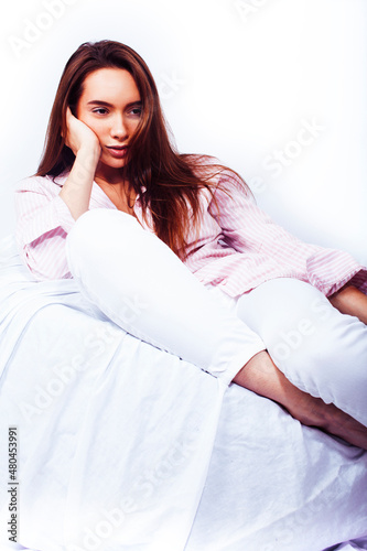 young pretty happy smiling sexy woman in her bed bedroom, lifestyle people concept