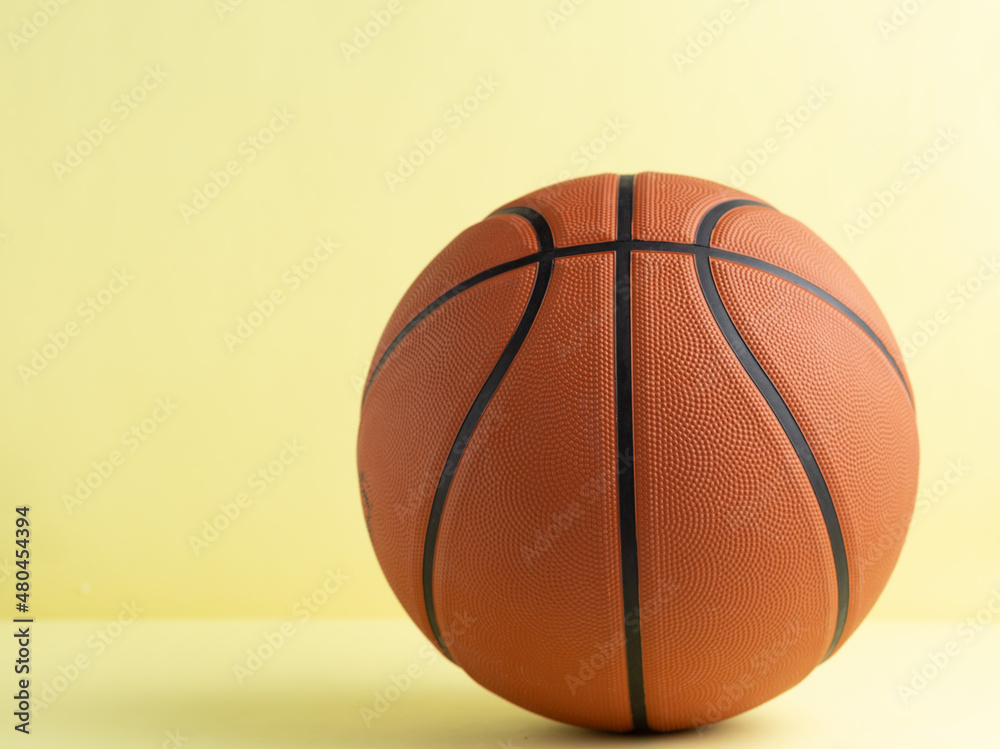 Basketball yellow background Isolated sport concept