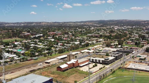 Train station on railway in Wagga Wagga town of Australia – aerial 4k.
 photo