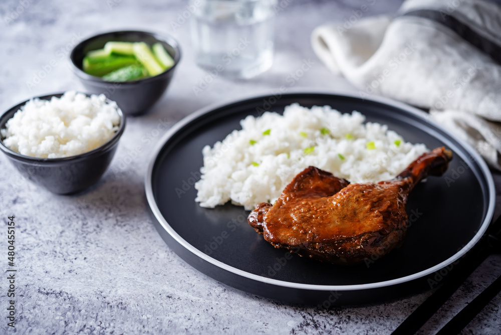 Peking duck with rice on a plate