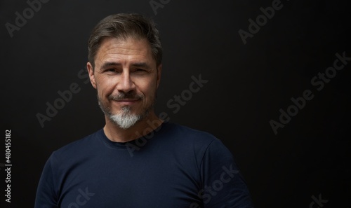 Portrait of mature age, middle age, mid adult man, happy confident smile. Copyspace.