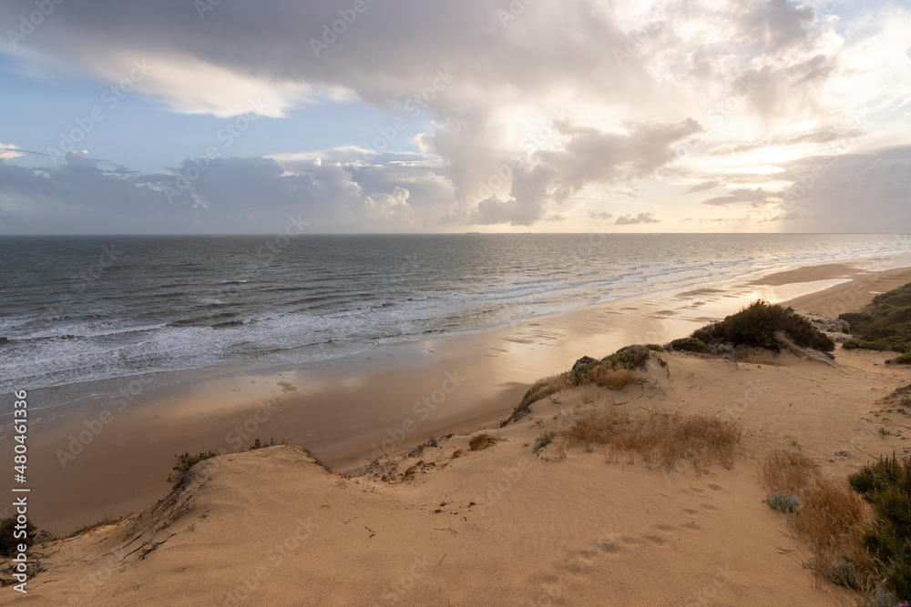 Mazagon beach, in the province of Huelva, Spain. One of the most beautiful beaches in Spain. Concept of going to the most beautiful places on vacation. Mazagon beach, in the province of Huelva, Spain. One of the most beautiful beaches in Spain. Concept of going to the most beautiful places on vacation.