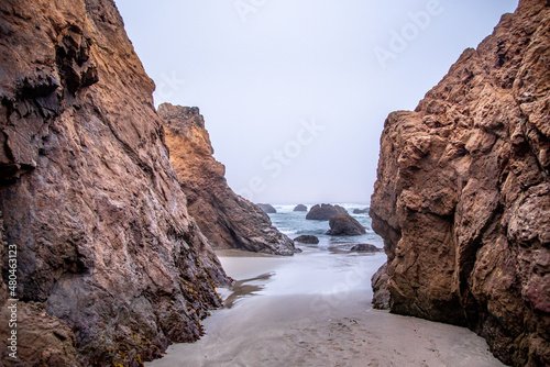 View Through Rocky formations into the Pacific Ocean from the California Coast on a Cloudy Day © Rachel