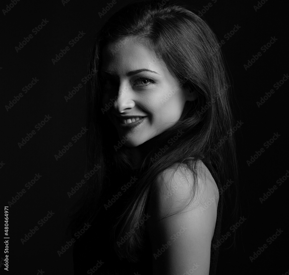 Beautiful happy laughing woman with red lipstick with bright makeup on dark red background with empty copy space. Closeup