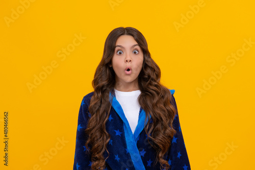 Wow. Girl looking with surprise. Surprised child in homewear. Its surprising