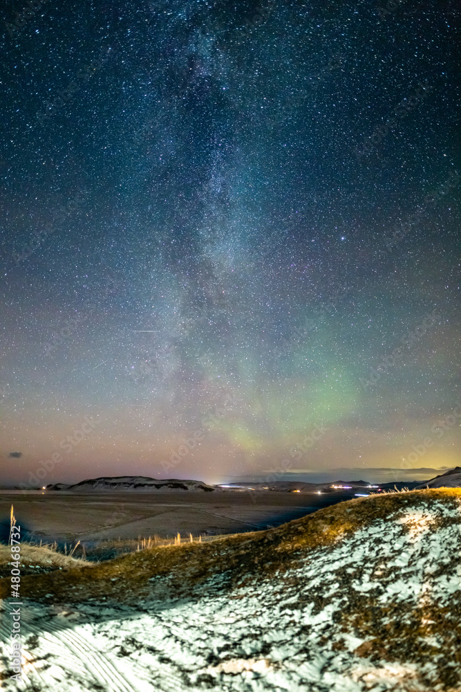 milky way over icelandic winter scene with small aurora milky way over icelandic winter scene with small aurora
