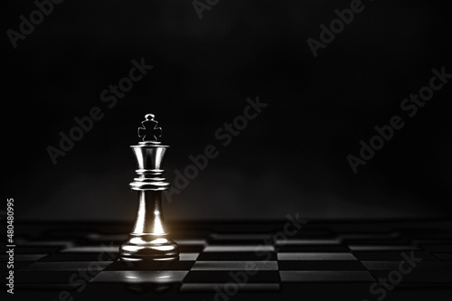 Close-up King chess standing on chess board concepts of business team and leadership strategy and organization risk management or team player.