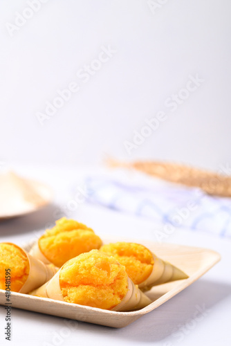 Homemade Toddy palm cake on natural plate with white background, Thai traditional dessert