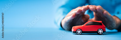 Hand Protecting Red Toy Car