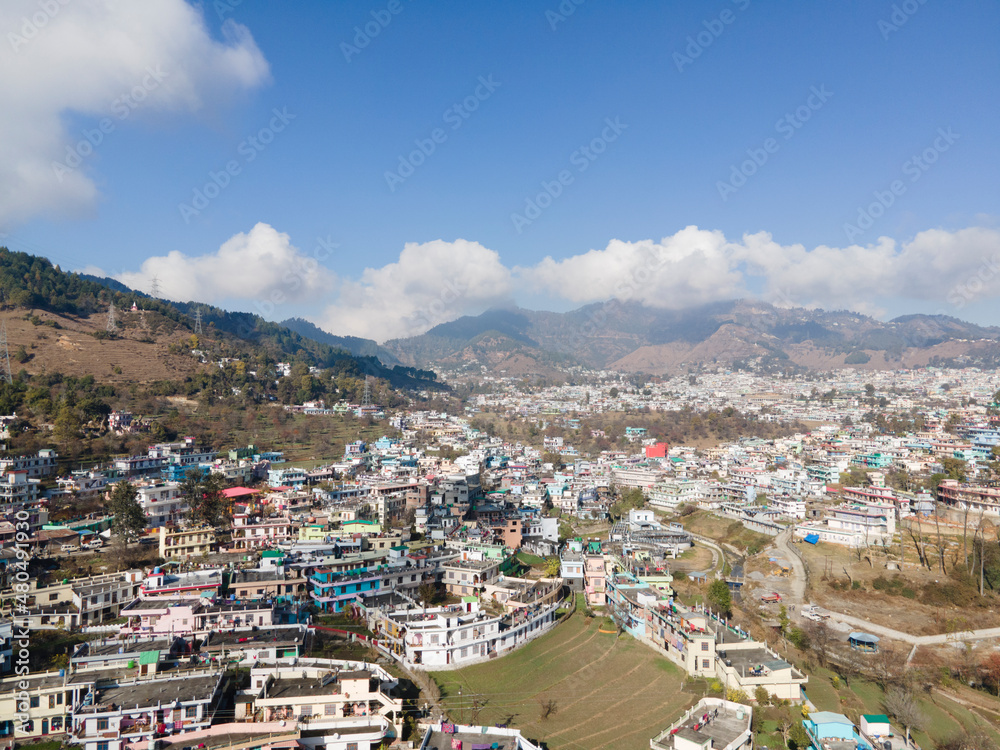 Aerial view of a Pithoragarh. Drone shot of a city situated in between the mountains.