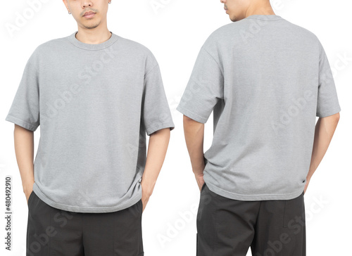 Young man in grey oversize t-shirt mockup front and back used as design template, isolated on white background with clipping path.