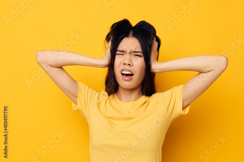 woman posing emotions problems studio yellow background unaltered