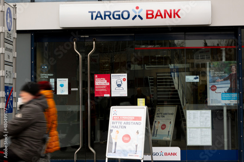 Koblenz, Germany - January 13, 2022: shop window of the local Targo Bank with passengers in blurry motion in front. Targo Bank is a German bank mainly for retail banking.